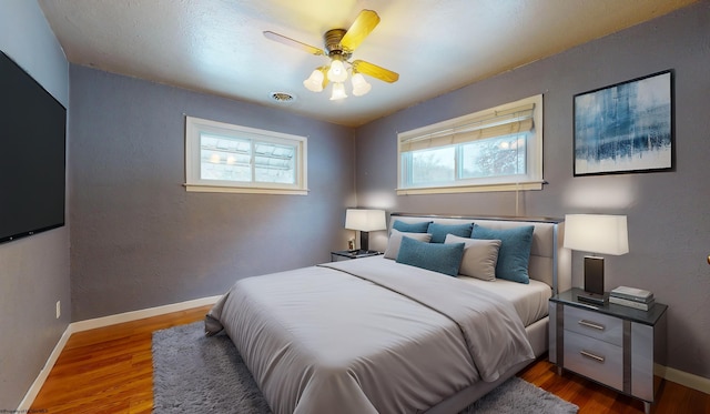 bedroom featuring ceiling fan and wood-type flooring