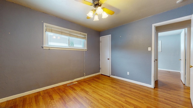 unfurnished bedroom with light hardwood / wood-style floors and ceiling fan