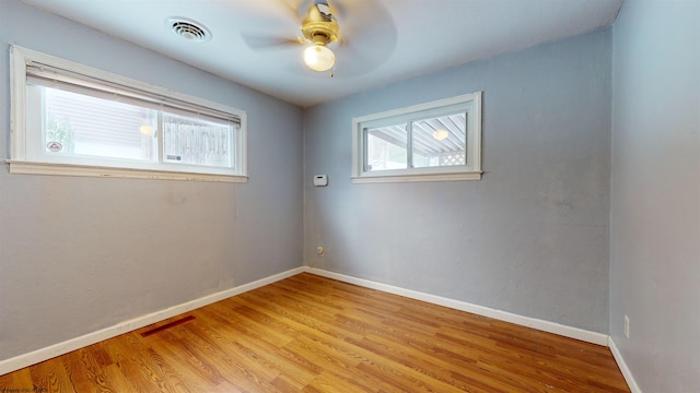 spare room with ceiling fan and light hardwood / wood-style flooring