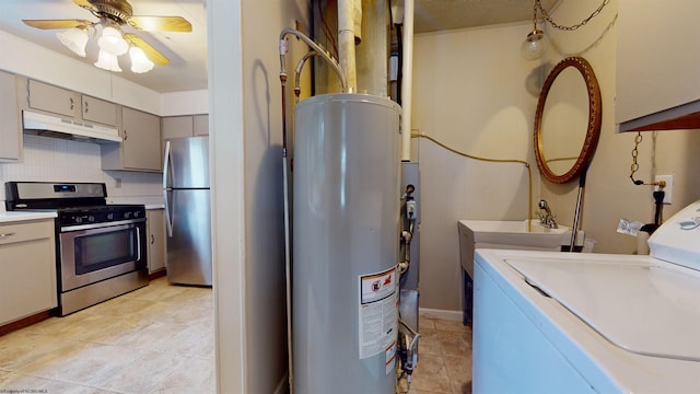 interior space with water heater, ceiling fan, and washer / dryer