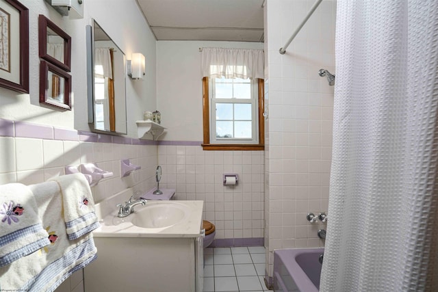 full bathroom with vanity, shower / bathtub combination with curtain, tile walls, tile patterned flooring, and toilet