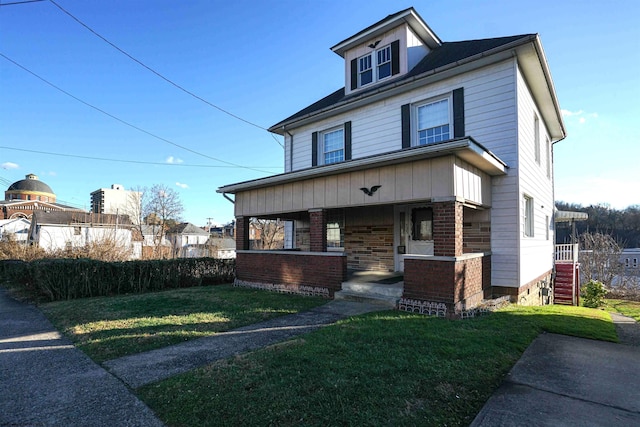 view of front of property with a front yard and a porch