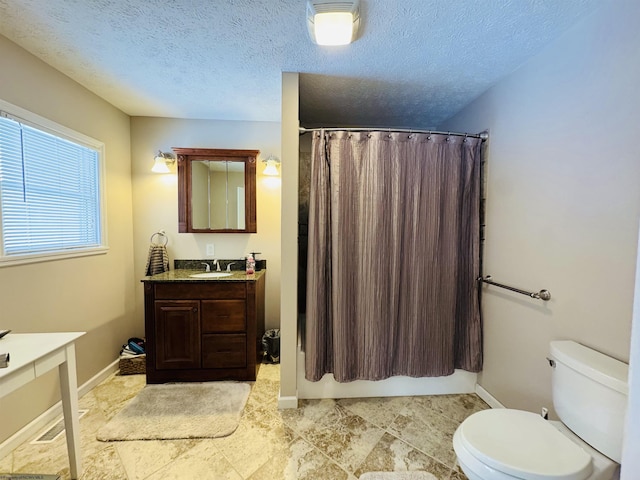 full bathroom with shower / bathtub combination with curtain, vanity, a textured ceiling, and toilet