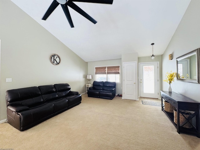 carpeted living room featuring ceiling fan and lofted ceiling