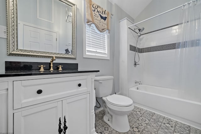 full bathroom featuring vanity, lofted ceiling, tile patterned floors, shower / bath combination with curtain, and toilet