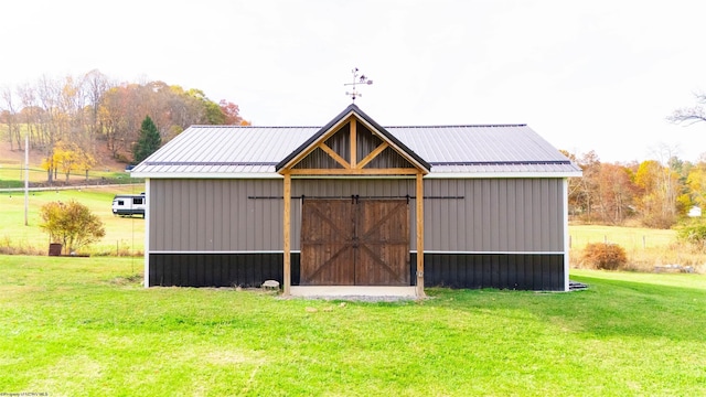 view of outbuilding with a lawn