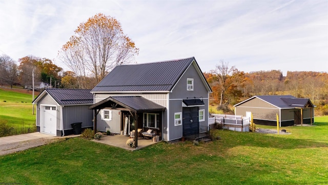 view of outbuilding with a garage and a yard