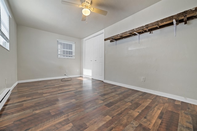 unfurnished room with ceiling fan and dark wood-type flooring