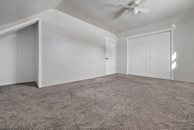 bonus room with carpet flooring, ceiling fan, and vaulted ceiling