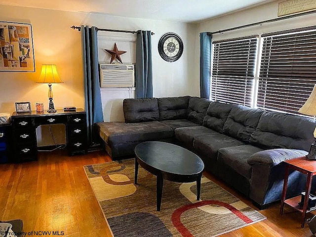 living room featuring hardwood / wood-style floors and cooling unit