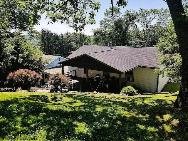 back of house featuring a yard