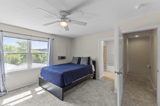 bedroom featuring light carpet and ceiling fan