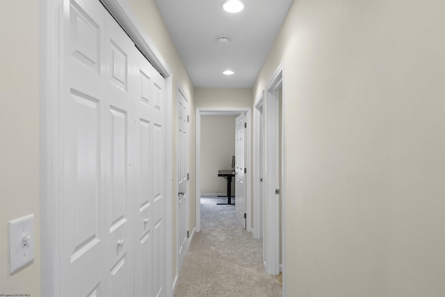 hallway with light carpet