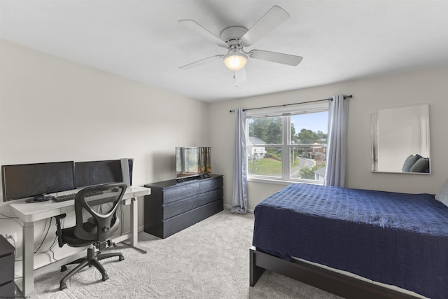 bedroom with light colored carpet and ceiling fan