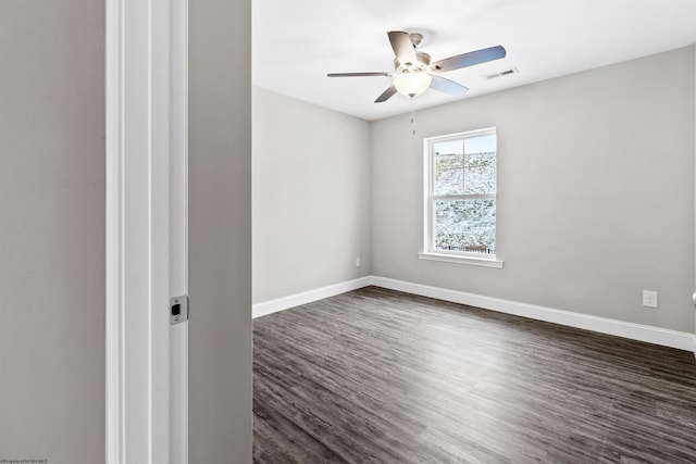 unfurnished room with dark hardwood / wood-style flooring and ceiling fan