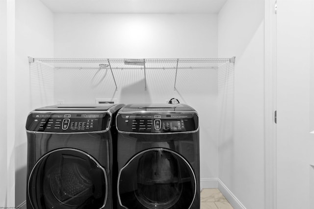 laundry area with independent washer and dryer