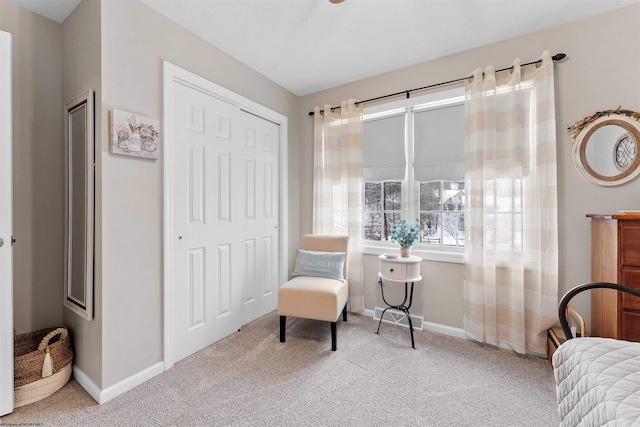 living area with light colored carpet