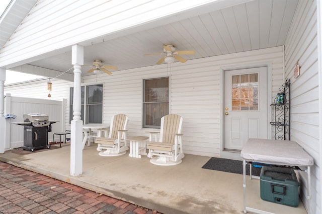 view of patio with ceiling fan and a grill