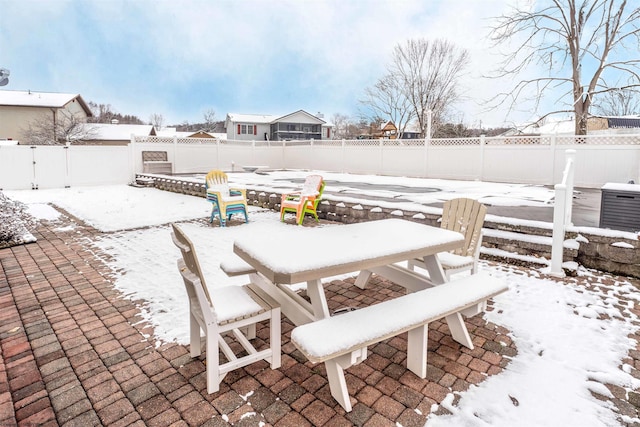 snow covered patio with central AC