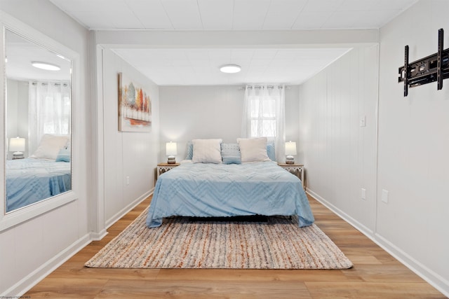 bedroom with wood-type flooring