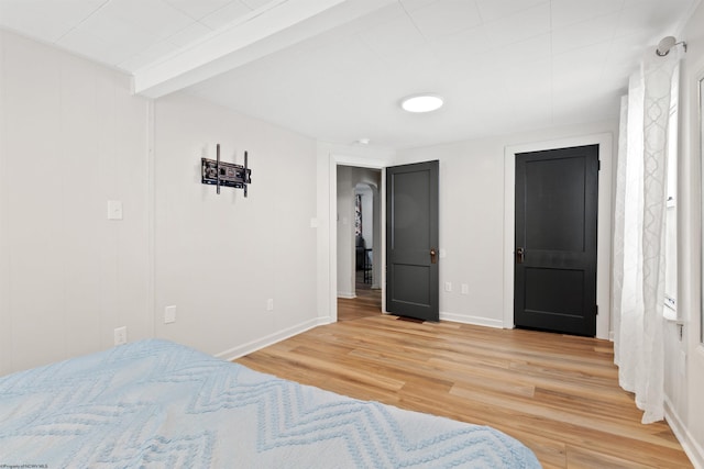 bedroom with hardwood / wood-style floors