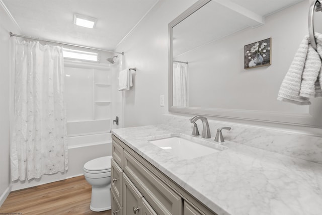 full bathroom featuring hardwood / wood-style floors, vanity, toilet, and shower / bathtub combination with curtain