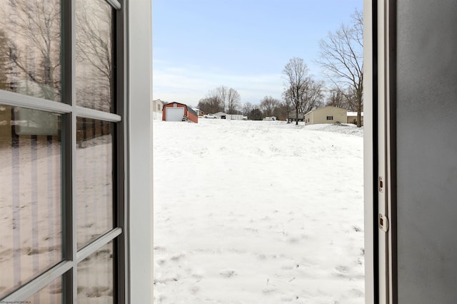 view of yard layered in snow