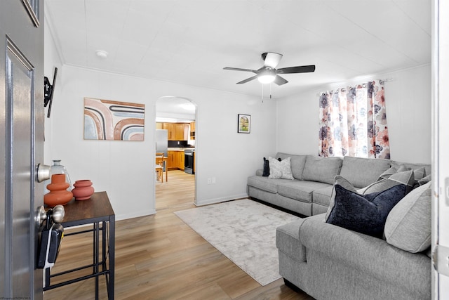 living room with ceiling fan and wood-type flooring