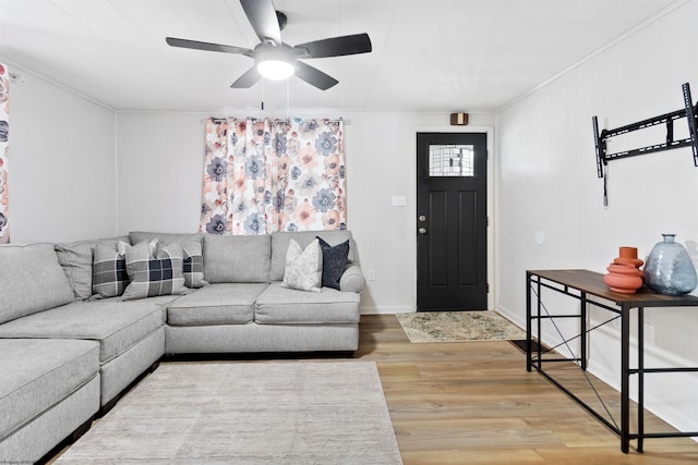 living room featuring hardwood / wood-style flooring and ceiling fan