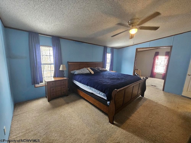 bedroom featuring carpet, ceiling fan, and multiple windows