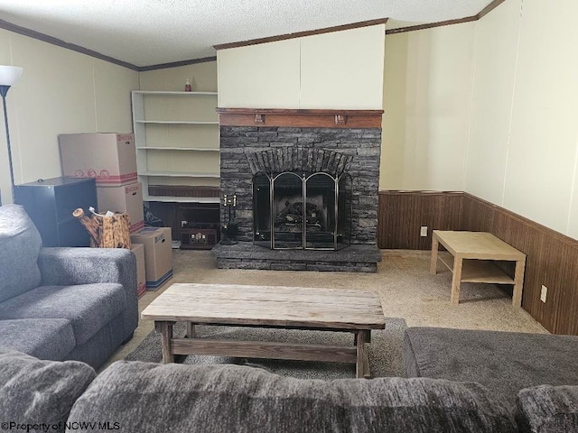 living room with carpet flooring, ornamental molding, a textured ceiling, a stone fireplace, and lofted ceiling