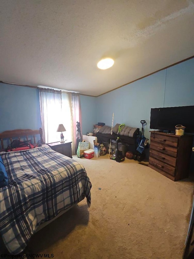 carpeted bedroom featuring a textured ceiling