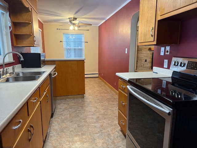 kitchen with stainless steel appliances, ceiling fan, crown molding, a baseboard heating unit, and sink