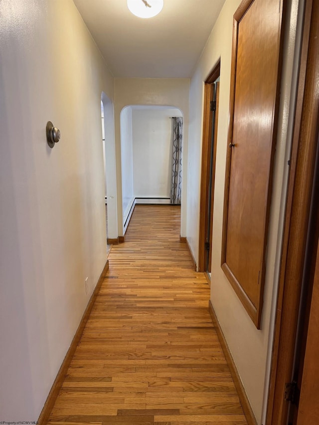 hall with light hardwood / wood-style floors