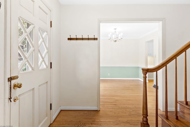 interior space with hardwood / wood-style floors and a chandelier