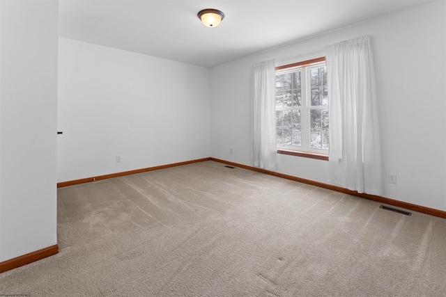 empty room featuring carpet flooring