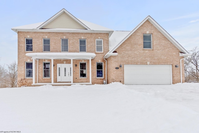 view of front of home with a garage and covered porch