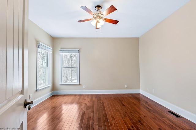 unfurnished room featuring hardwood / wood-style flooring and ceiling fan