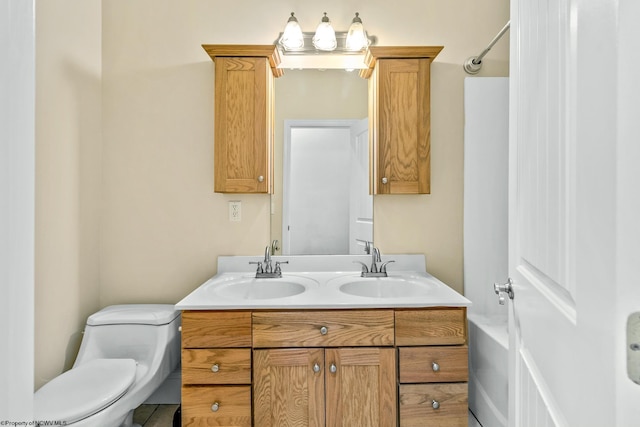 bathroom featuring vanity and toilet