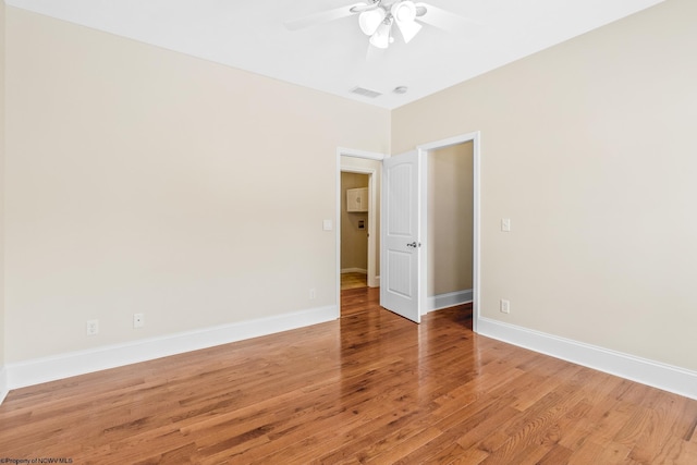 unfurnished room featuring hardwood / wood-style flooring and ceiling fan