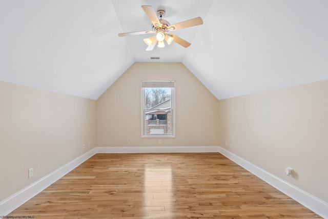 bonus room featuring ceiling fan, vaulted ceiling, and light hardwood / wood-style flooring