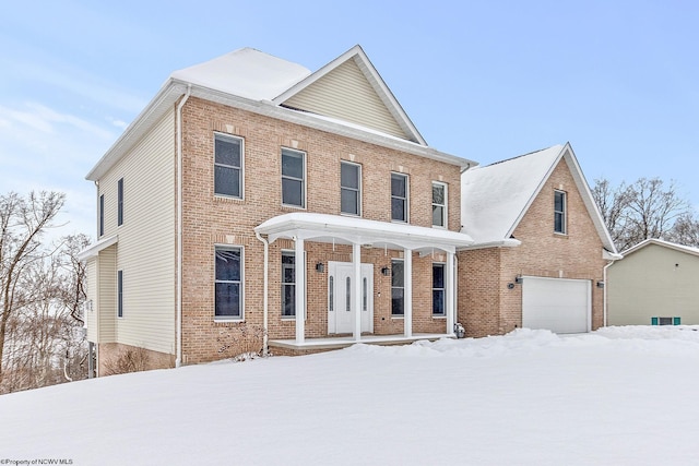 view of front of house featuring a garage and covered porch