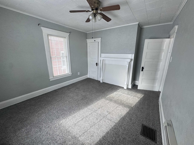 interior space with carpet floors, ceiling fan, and crown molding