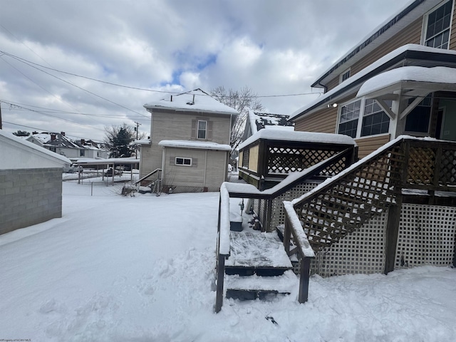 view of snow covered deck