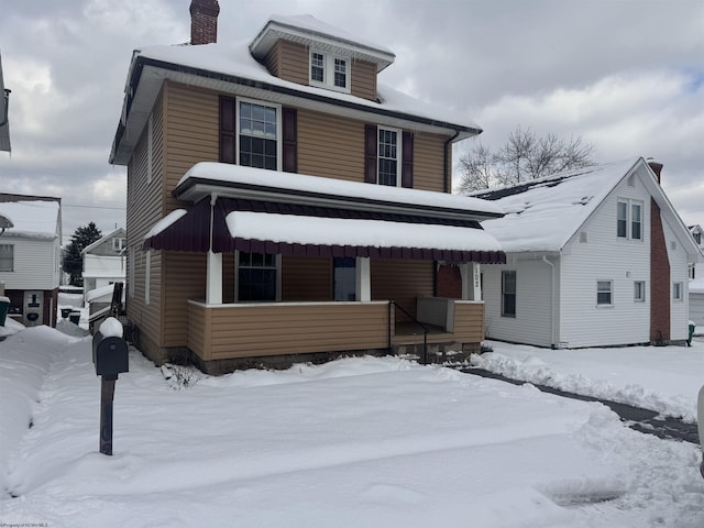 front of property featuring covered porch