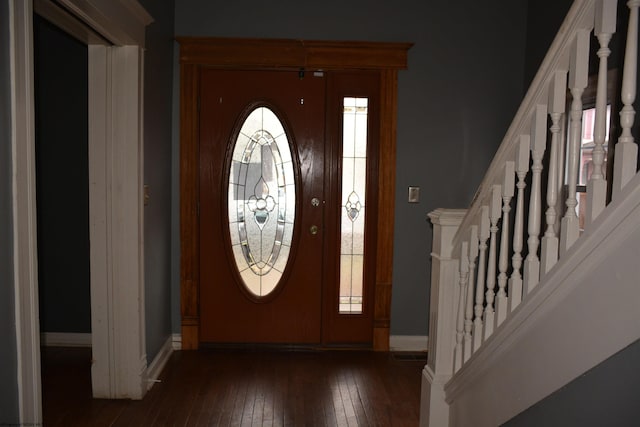 entrance foyer with dark hardwood / wood-style floors