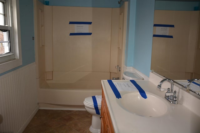 full bathroom with bathtub / shower combination, vanity, and toilet