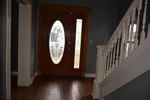 foyer entrance with dark hardwood / wood-style flooring