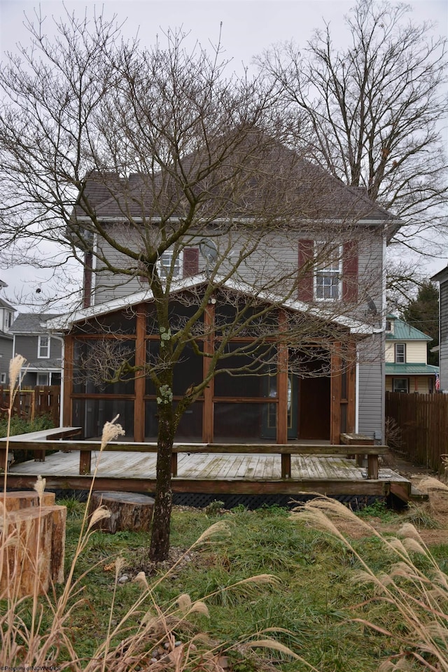 back of house with a wooden deck