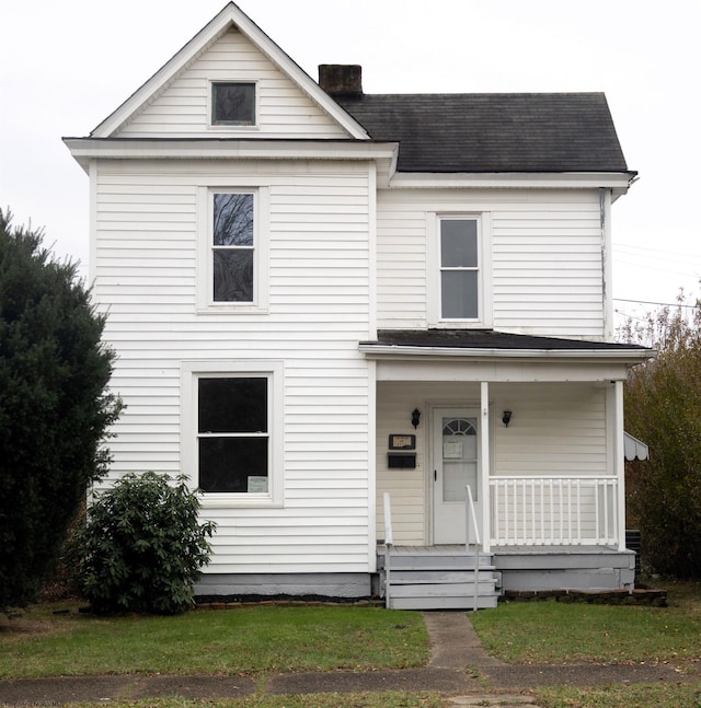 view of front of home featuring a front lawn and a porch